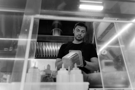 image of a busy restaurant kitchen with staff working efficiently