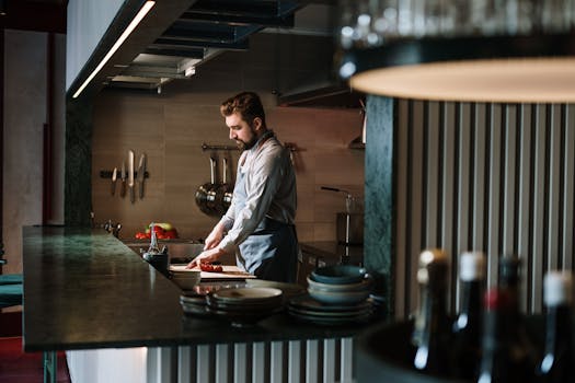 chef preparing a plate in a restaurant