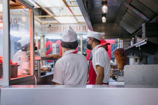 restaurant workers at busy kitchen