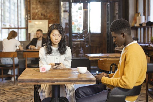 customers on their smartphones at a restaurant