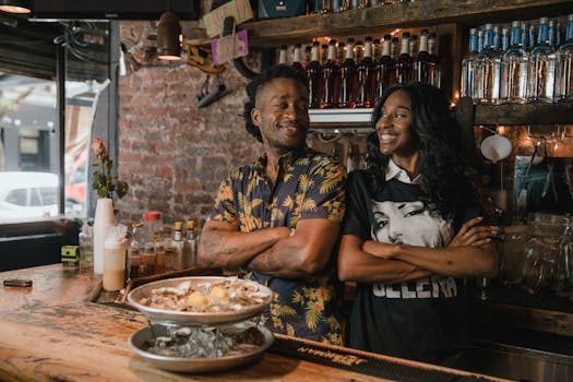 happy restaurant staff celebrating with a paycheck